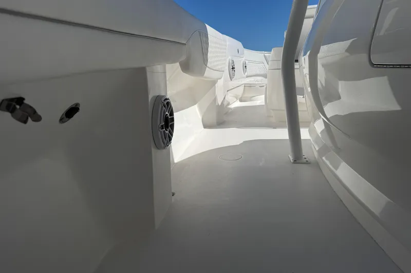 Slide: The Image of 2024 Intrepid 407 Nomad FE boat interior with sleek white design and modern features. - 36