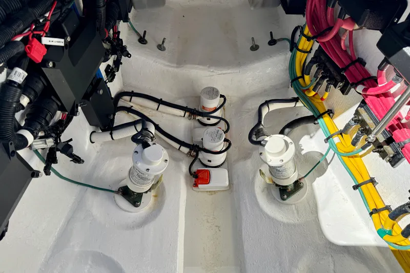 Slide: The Image of Bilge area of 2024 Intrepid 407 Nomad FE with wiring and pumps visible. - 40