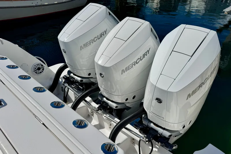 Slide: The Image of Triple Mercury outboard engines on a 2024 Intrepid 407 Nomad FE boat. - 42
