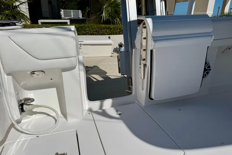 Slide: The Image of 2024 Intrepid 407 Nomad FE boat interior with sleek white design and modern features. - 44
