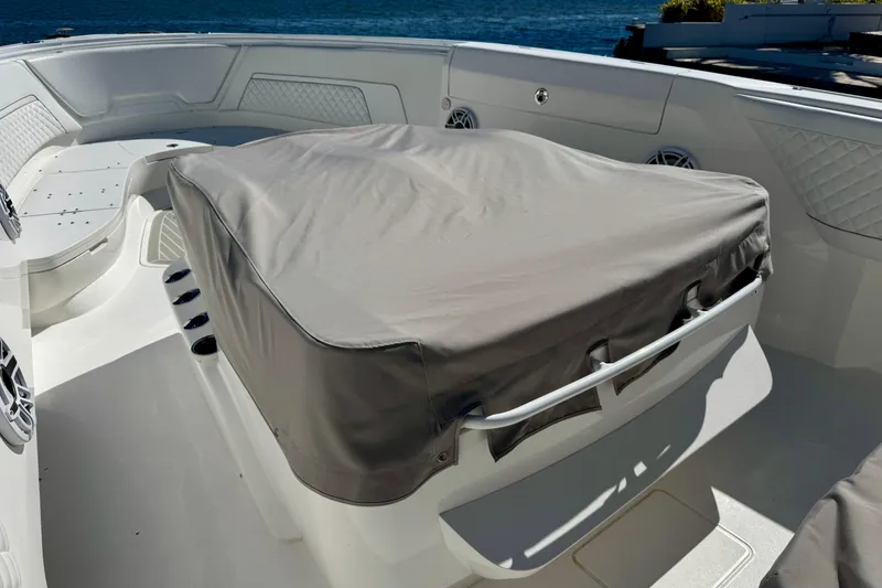 Slide: The Image of 2024 Intrepid 407 Nomad FE boat interior with covered seating area. - 56