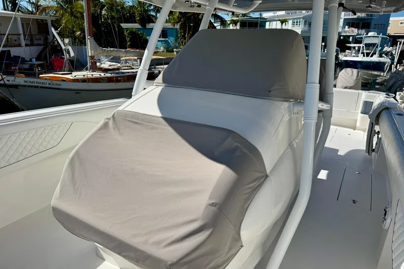 Slide: The Image of 2024 Intrepid 407 Nomad FE boat interior with covered seating area. - 58