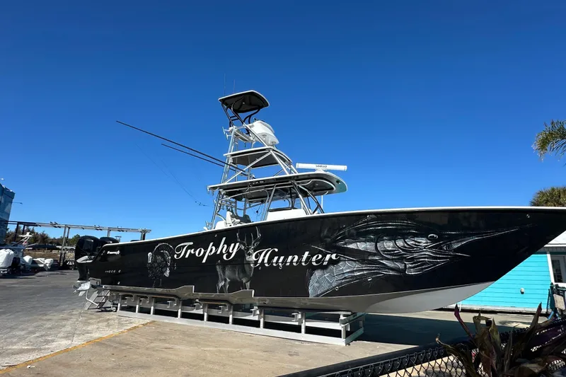 Slide: The Image of 2023 Freeman 42LR boat "Trophy Hunter" with striking fish graphics on display. - 1