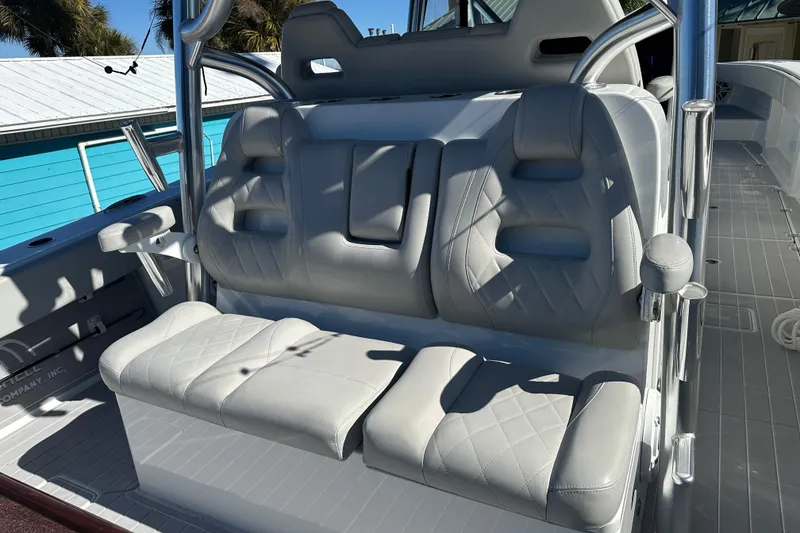 Slide: The Image of Luxurious seating on 2023 Freeman 42LR boat, featuring plush, diamond-stitched upholstery. - 14