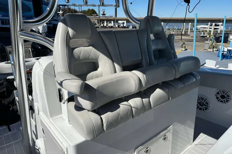 Slide: The Image of Luxurious seating on a 2023 Freeman 42LR boat, featuring plush gray upholstery. - 17
