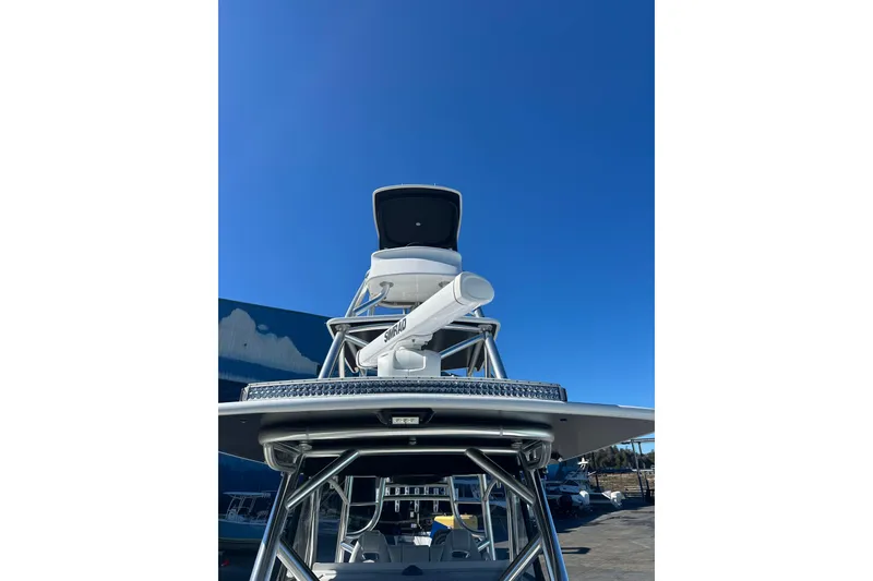 Slide: The Image of 2023 Freeman 42LR boat with radar equipment against clear blue sky. - 20
