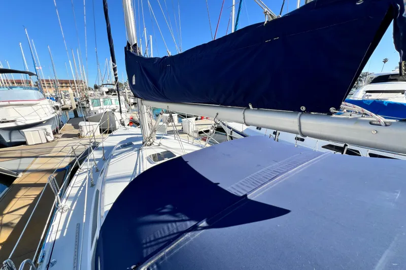 Slide: The Image of 1998 Catalina 36 MkII sailboat docked at marina, blue sail cover, sunny day. - 15