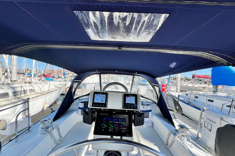 Slide: The Image of Cockpit view of 1998 Catalina 36 MkII sailboat with navigation instruments and marina backdrop. - 24