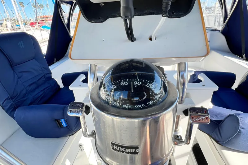 Slide: The Image of Cockpit of 1998 Catalina 36 MkII sailboat with compass and blue seating. - 27