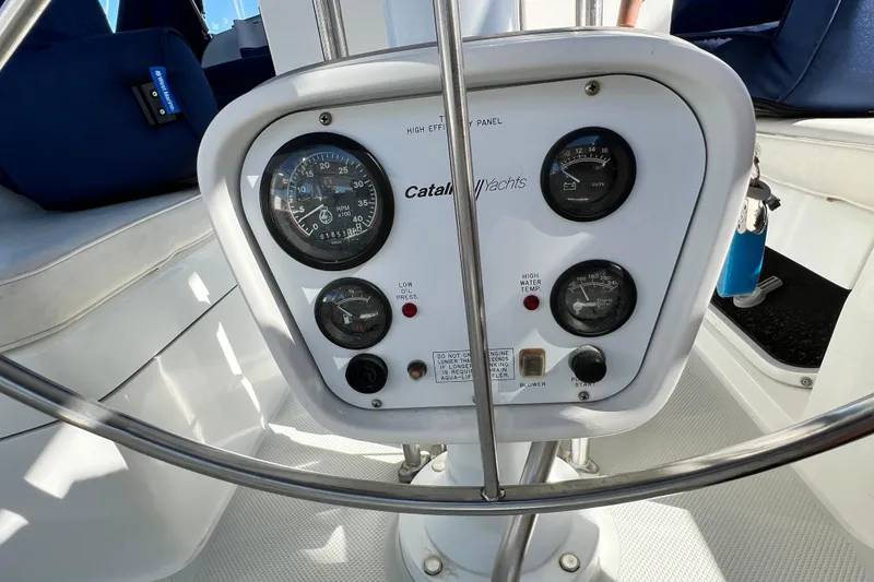 Slide: The Image of Control panel of a 1998 Catalina 36 MkII yacht with gauges and indicators. - 28