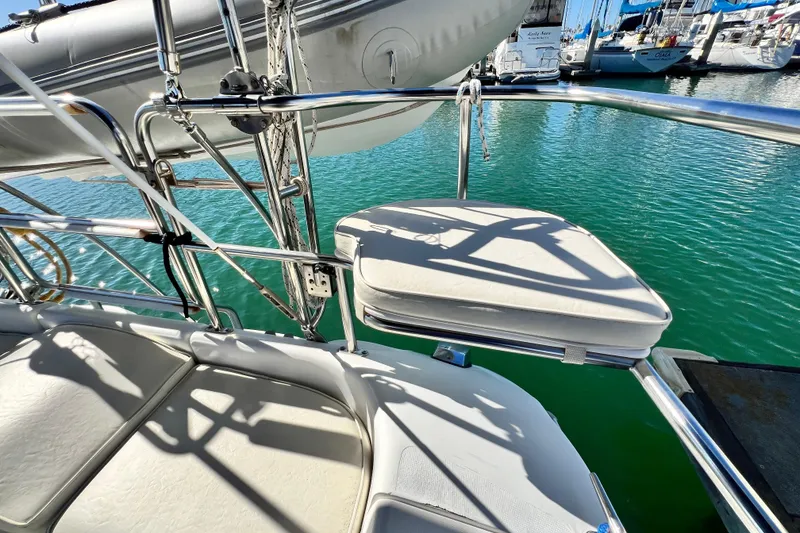 Slide: The Image of Sailboat cockpit of 1998 Catalina 36 MkII with cushioned seating, docked in marina. - 29