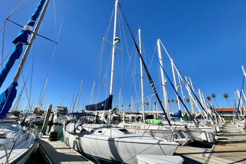 Slide: The Image of Sailboats docked at marina under clear blue sky, featuring 1998 Catalina 36 MkII. - 3