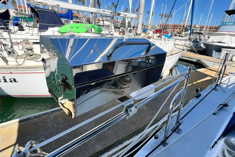 Slide: The Image of Shiny grill mounted on a 1998 Catalina 36 MkII sailboat at a marina. - 30