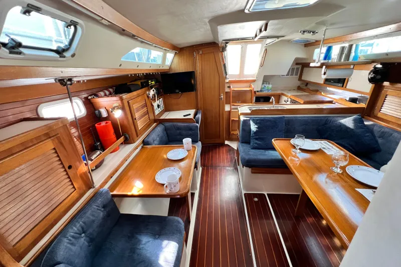 Slide: The Image of Interior of 1998 Catalina 36 MkII sailboat with cozy seating and dining area. - 40