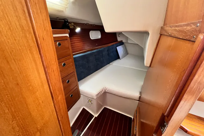 Slide: The Image of Interior cabin of 1998 Catalina 36 MkII sailboat with wood finish and cozy berth. - 42