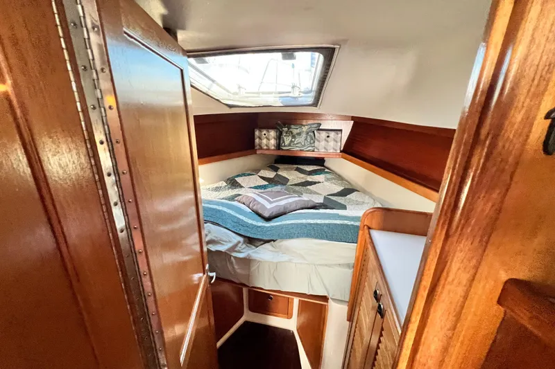 Slide: The Image of Cozy cabin interior of 1998 Catalina 36 MkII sailboat with quilted bedding. - 45