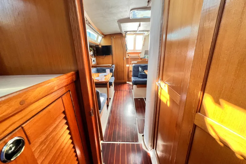 Slide: The Image of Interior of 1998 Catalina 36 MkII sailboat with wooden finishes and cozy seating area. - 47