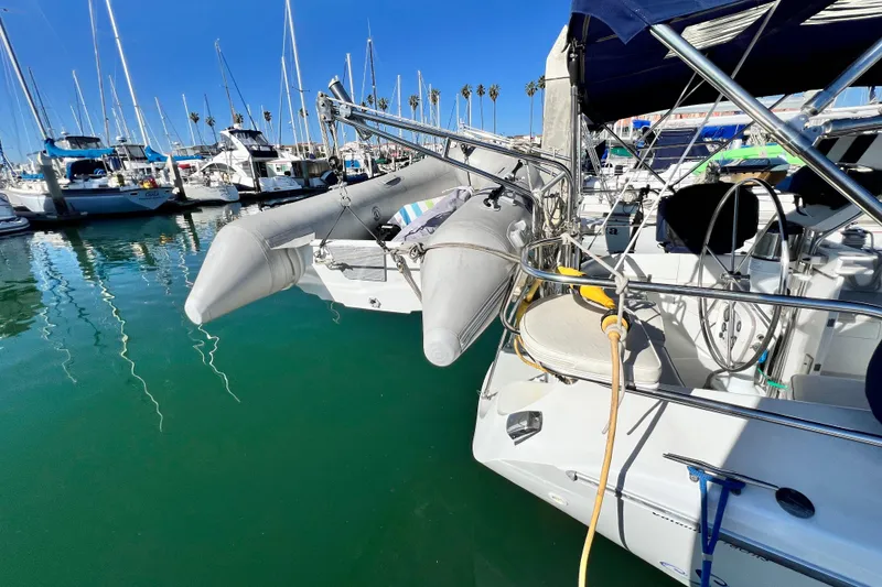Slide: The Image of 1998 Catalina 36 MkII sailboat docked with inflatable dinghy attached. - 5