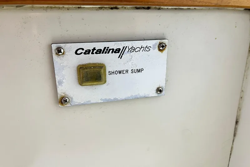 Slide: The Image of Catalina 36 MkII 1998 shower sump label on yacht interior panel. - 50