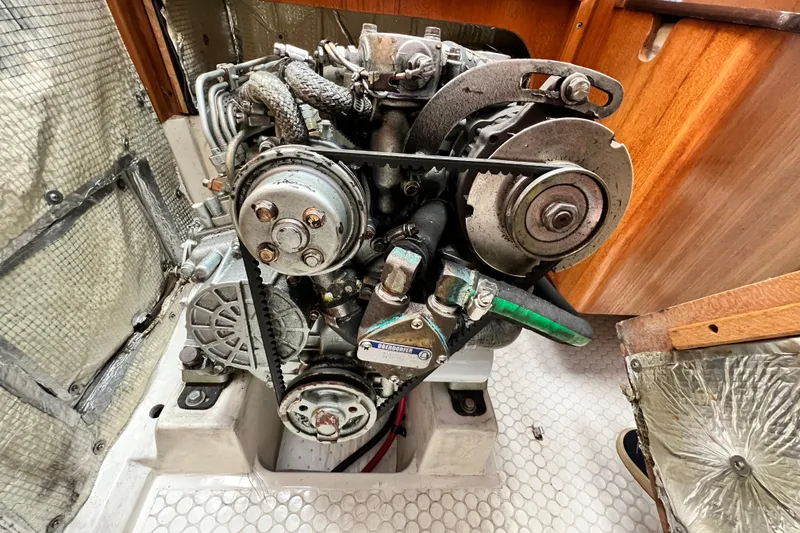 Slide: The Image of Engine of a 1998 Catalina 36 MkII sailboat, showcasing mechanical components. - 54