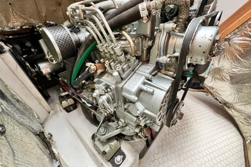Slide: The Image of Engine of a 1998 Catalina 36 MkII sailboat, showcasing mechanical components. - 55