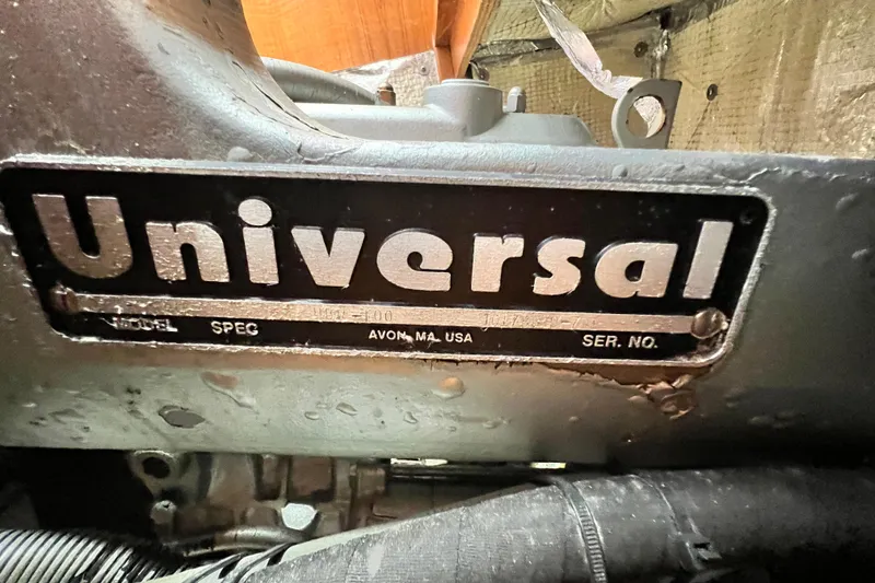 Slide: The Image of Close-up of a Universal engine label on a 1998 Catalina 36 MkII sailboat. - 56