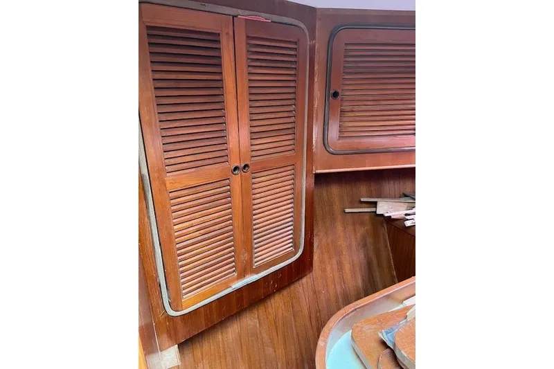Slide: The Image of Interior of 1998 Tayana 55 sailboat with wooden louvered cabinets. - 16
