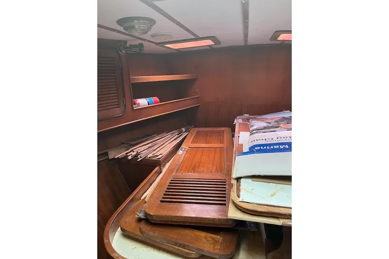 Slide: The Image of Interior of 1998 Tayana 55 yacht with wooden panels and storage shelves. - 20