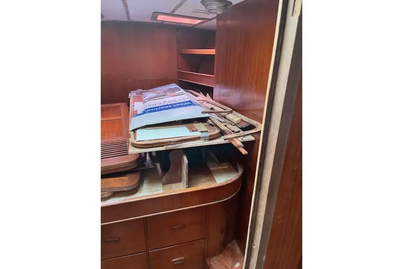 Slide: The Image of Interior of 1998 Tayana 55 yacht with wooden cabinetry and storage items. - 21