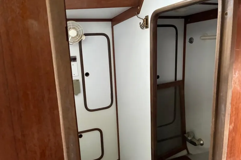 Slide: The Image of Interior of 1998 Tayana 55 yacht bathroom with wooden accents and compact design. - 22