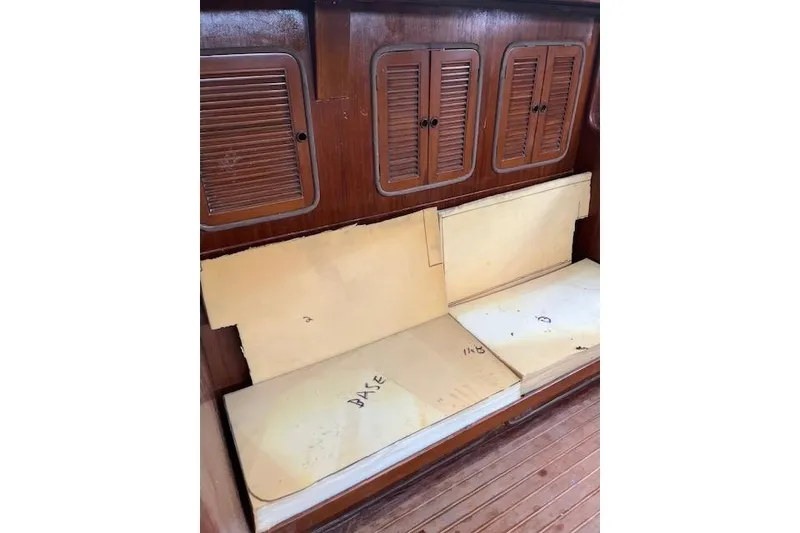 Slide: The Image of Interior of 1998 Tayana 55 yacht with wooden cabinets and cushioned seating. - 28