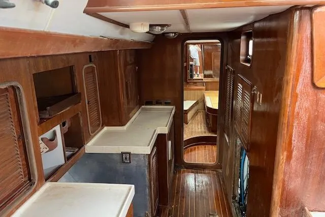 Slide: The Image of Interior of 1998 Tayana 55 yacht with wooden cabinetry and flooring. - 31