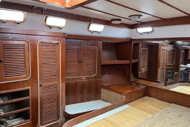 Slide: The Image of Interior of 1998 Tayana 55 yacht with wooden cabinetry and ample storage space. - 35