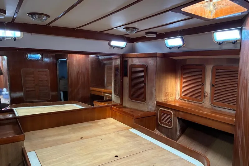 Slide: The Image of Interior of 1998 Tayana 55 yacht with wooden cabinetry and ample natural light. - 36