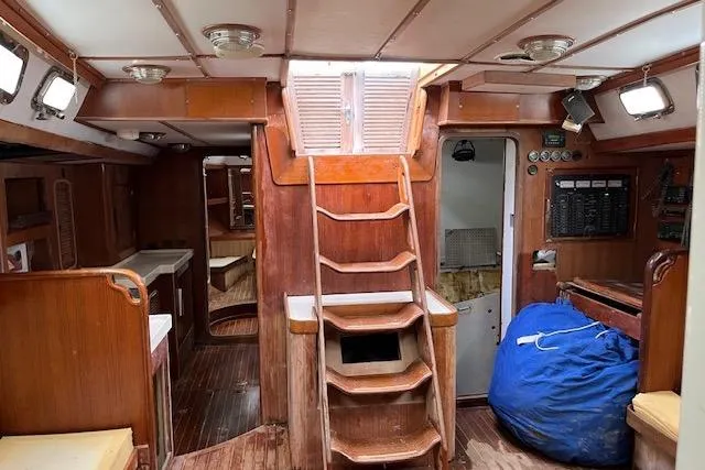 Slide: The Image of Interior of 1998 Tayana 55 sailboat with wooden finishes and staircase. - 8