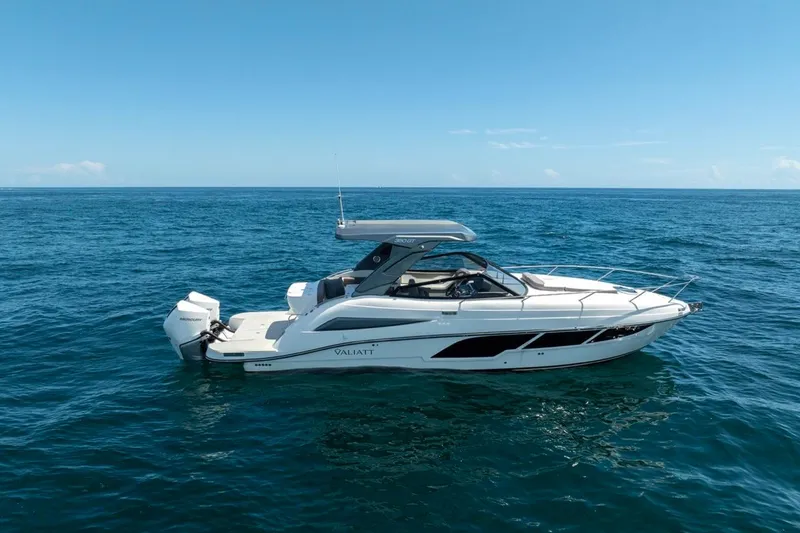 The Image of 2026 Valiatt 350 GT luxury boat cruising on open sea under clear blue sky. - 0