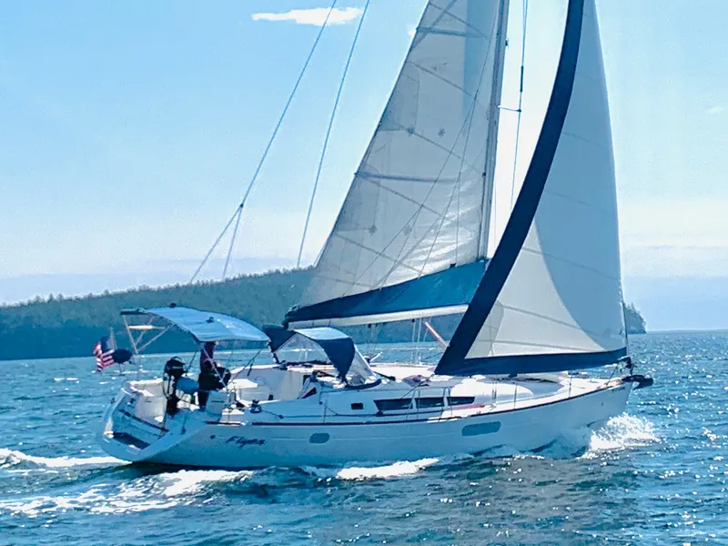 Slide: The Image of 2010 Jeanneau Sun Odyssey 44i sailboat cruising on open water. - 27