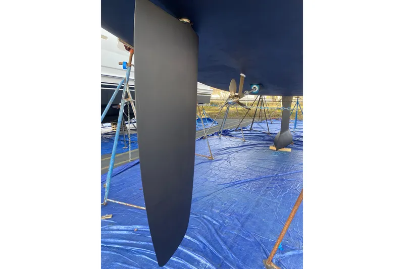 Slide: The Image of Jeanneau Sun Odyssey 44i 2010 sailboat keel and propeller on blue tarp. - 32