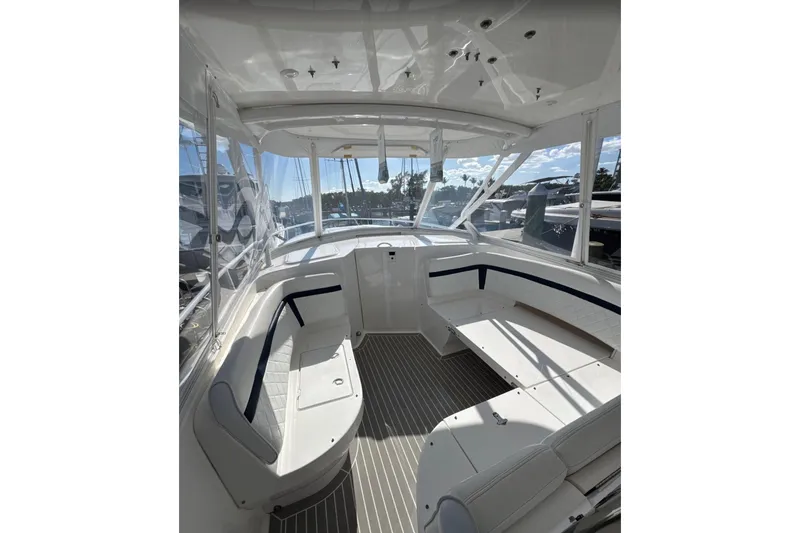 Slide: The Image of 2015 Intrepid 400 Cuddy boat interior with spacious seating and sleek design. - 10