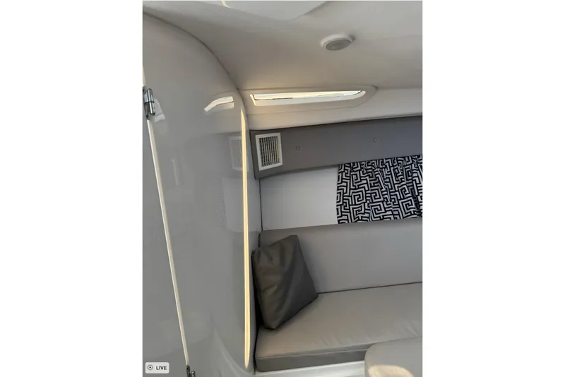 Slide: The Image of Interior of 2015 Intrepid 400 Cuddy boat with modern seating and patterned curtain. - 35