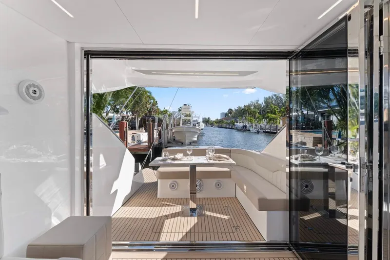 Slide: The Image of Luxurious 2026 Valiatt 410 HT yacht interior with elegant seating and waterfront view. - 2