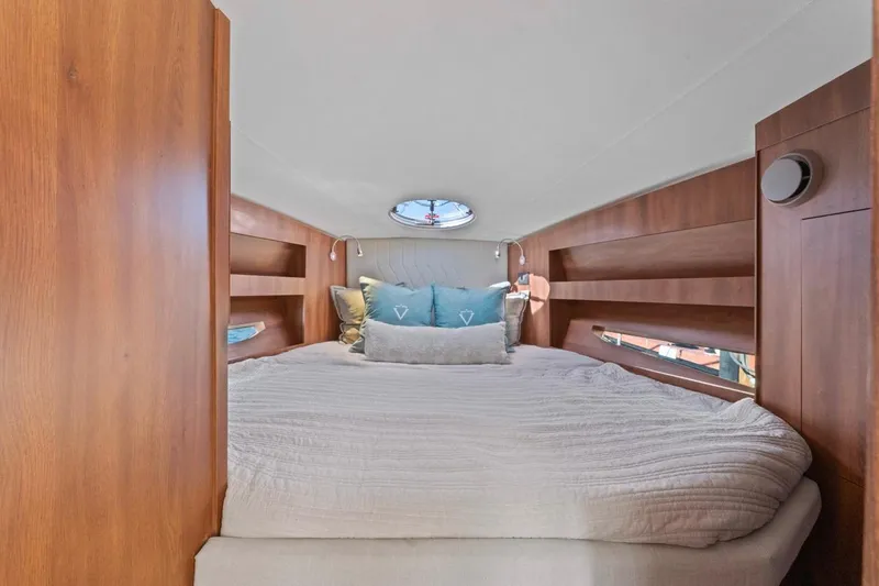 Slide: The Image of Cozy cabin interior of 2026 Valiatt 410 HT yacht with plush bedding and wooden accents. - 7