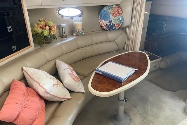 Slide: The Image of Luxurious 1995 Regal 402 yacht interior with plush seating and elegant decor. - 15