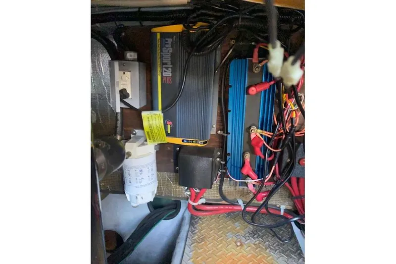 Slide: The Image of Electrical components and wiring inside a 1995 Regal 402 boat. - 16