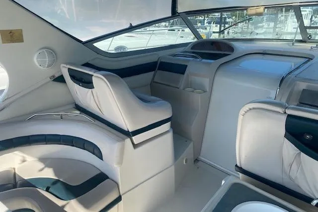 Slide: The Image of Interior of a 1995 Regal 402 boat, featuring plush seating and modern design. - 4