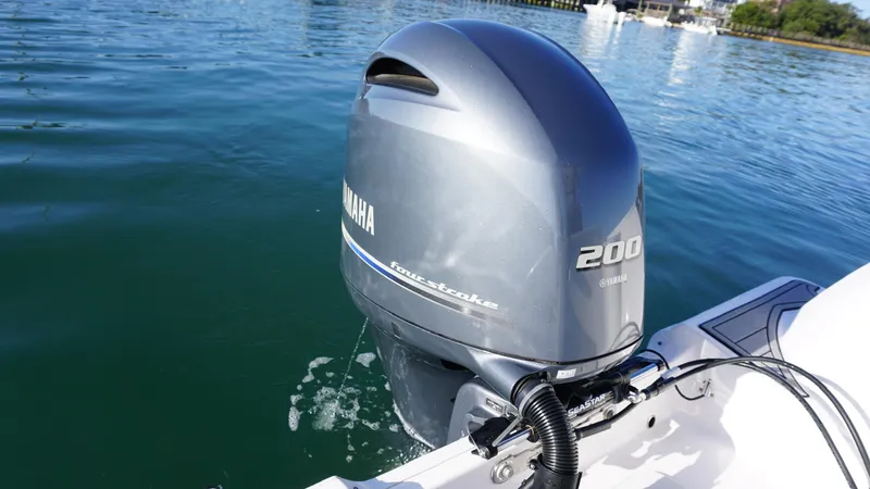 Slide: The Image of Yamaha 200 horsepower outboard motor on 2022 Sea Fox 228 Commander boat in water. - 6
