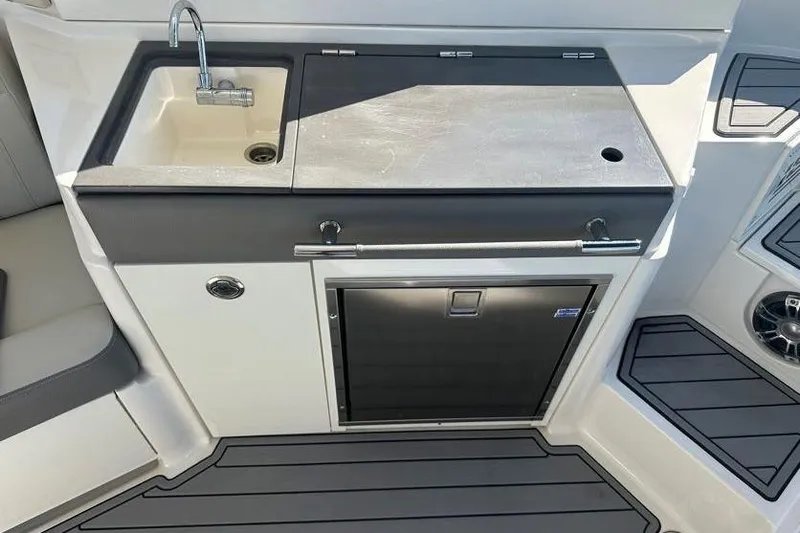 Slide: The Image of 2020 Sea Ray SLX 350 Outboard boat kitchenette with sink and storage. - 18