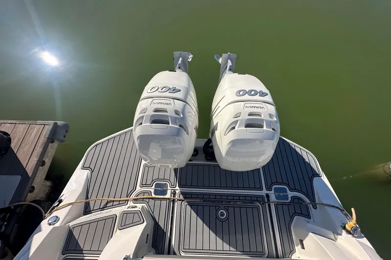 Slide: The Image of 2020 Sea Ray SLX 350 Outboard with twin 400 horsepower engines on a sunny day. - 27