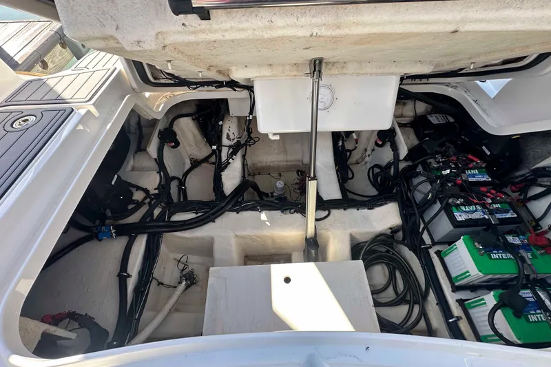 Slide: The Image of Engine compartment of a 2020 Sea Ray SLX 350 Outboard, showing wiring and battery setup. - 30