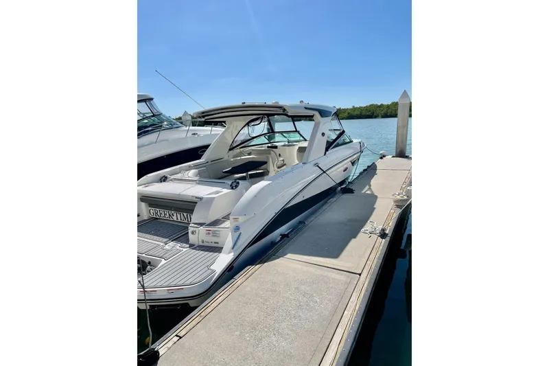 Slide: The Image of 2020 Sea Ray SLX 350 Outboard docked on a sunny day. - 35